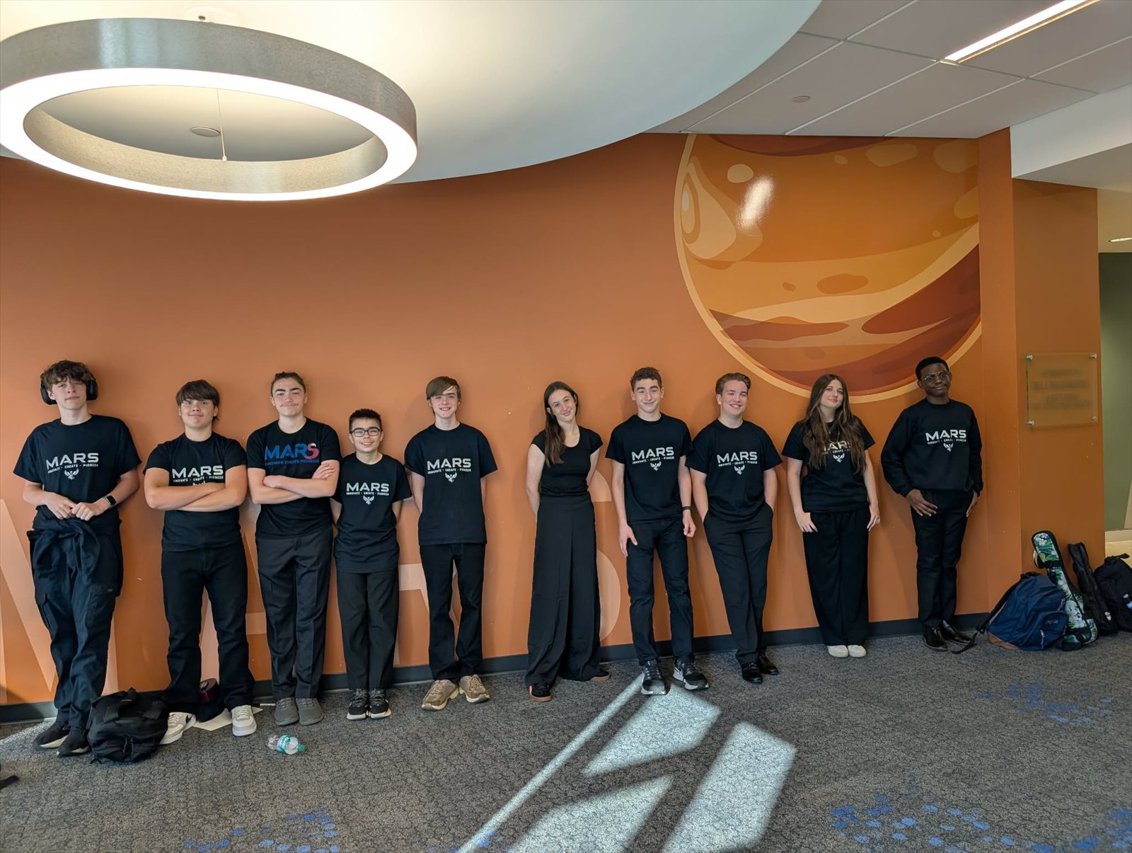 MARS students gathered together in matching school shirts.